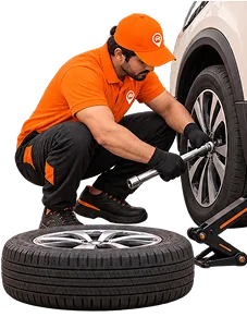 Mechanic tightening wheel bolts with torque wrench